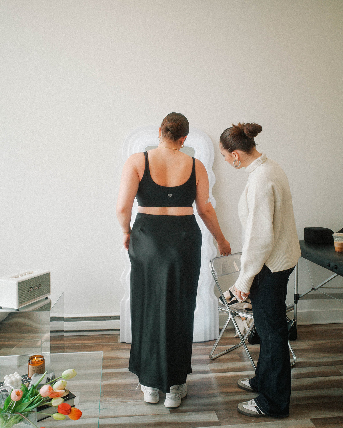 Consultation of two girl for tattoo placement