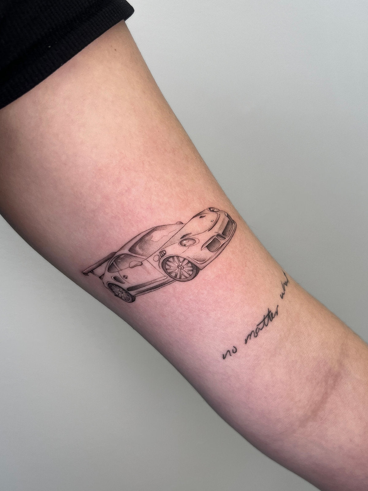 Car tattoo fine line on arm