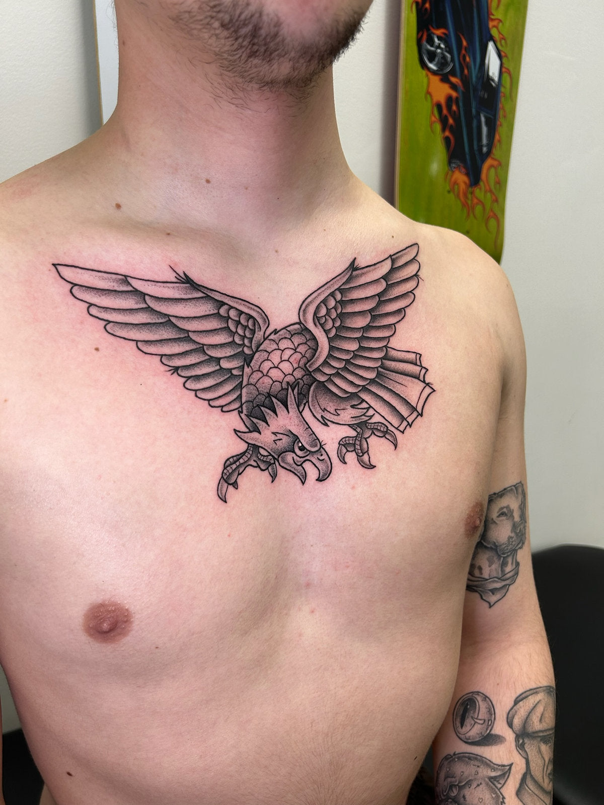 Tattoo of an eagle on a client's chest